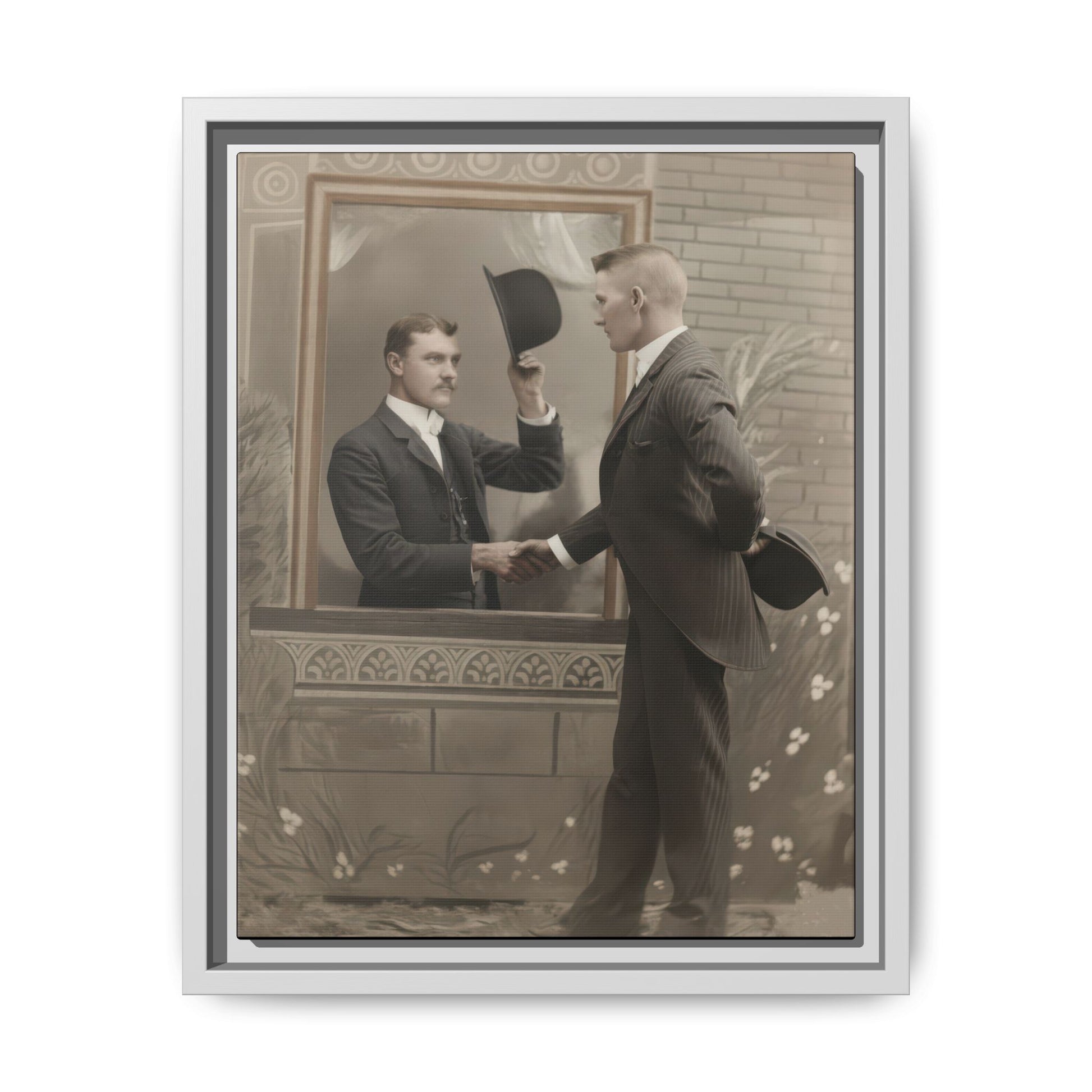 Vintage studio photograph of two formally dressed men with hats in an illusion-style handshake scene