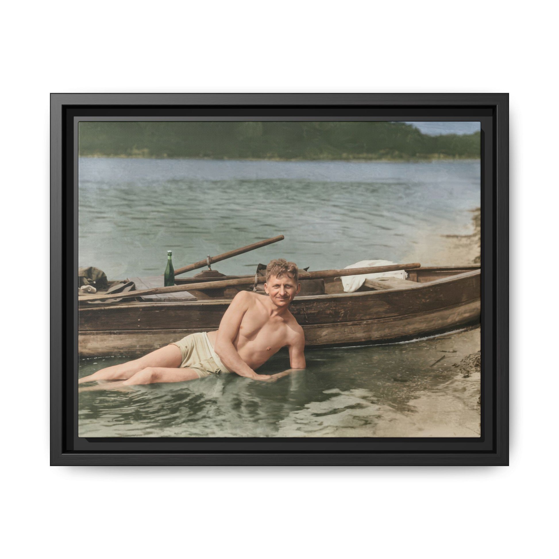 man reclining water beside boat vintage photograph restored 
