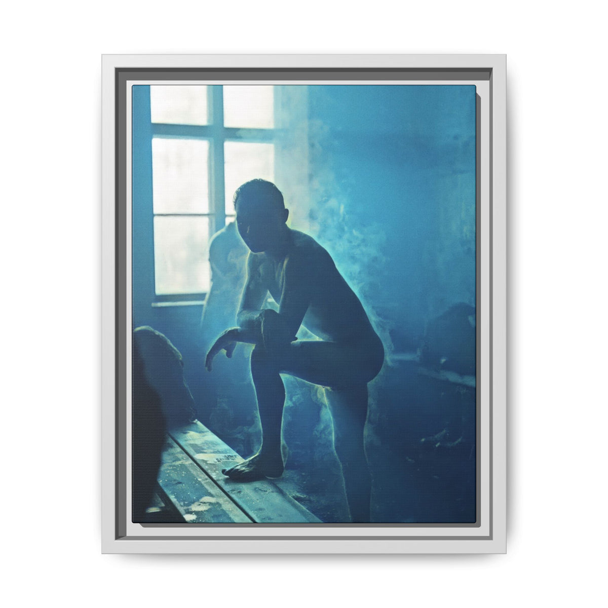 Restored male figure photograph with cyan-blue tones, bright divided window panes, and a wooden bench extending diagonally through the foreground.