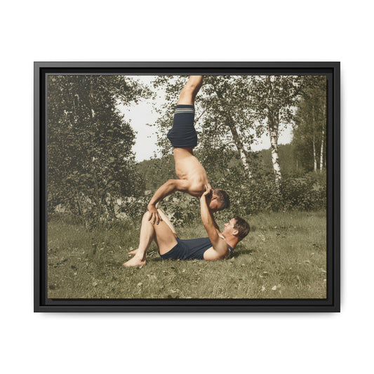 Historical outdoor photograph with inverted balancing pose in grassy setting 