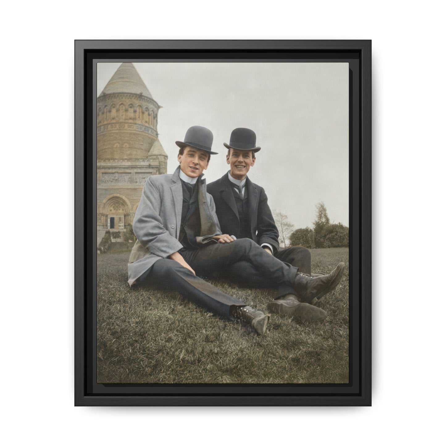 Early 20th-century outdoor double portrait framed canvas wall art with two men seated before a large stone building