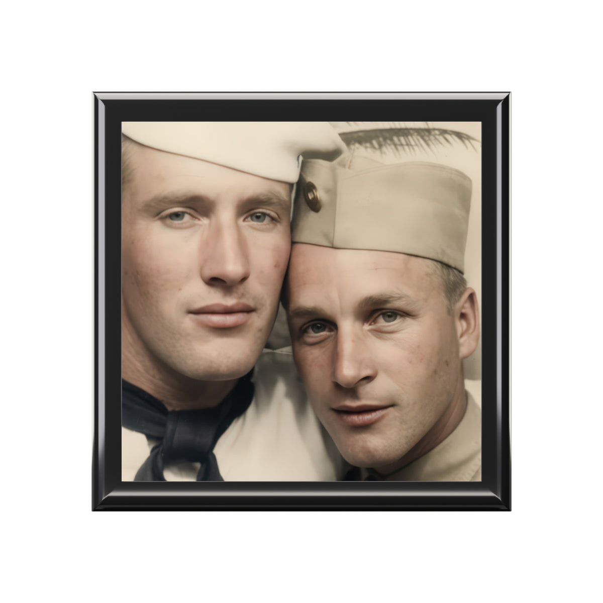 Closed wooden keepsake box viewed at an angle, with a vintage portrait of two uniformed men leaning close on the ceramic lid.