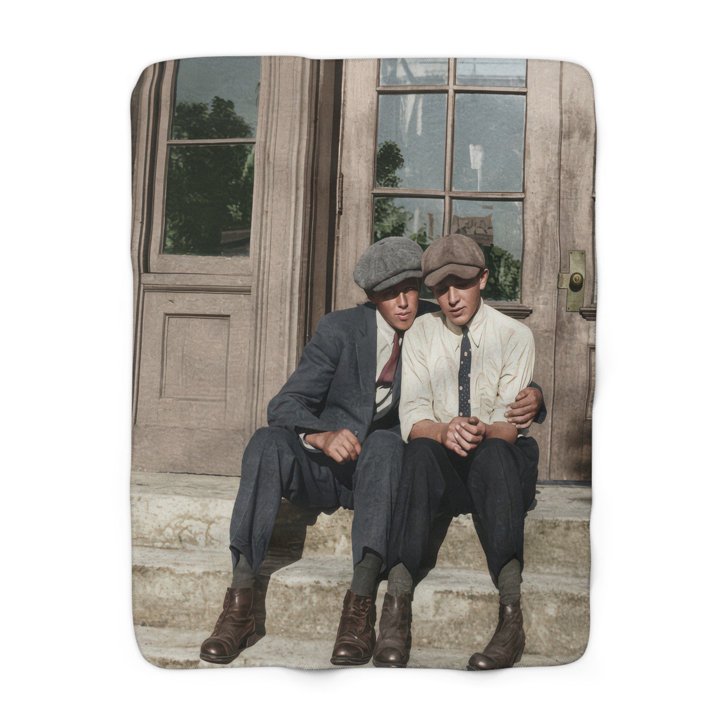 Heirloom sherpa blanket featuring two young men seated together on stone steps 