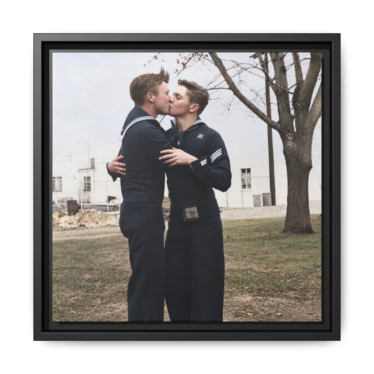 Restored vintage photograph of two men in dark sailor uniforms kissing outdoors, reproduced as framed canvas wall art by Walt & Pete.