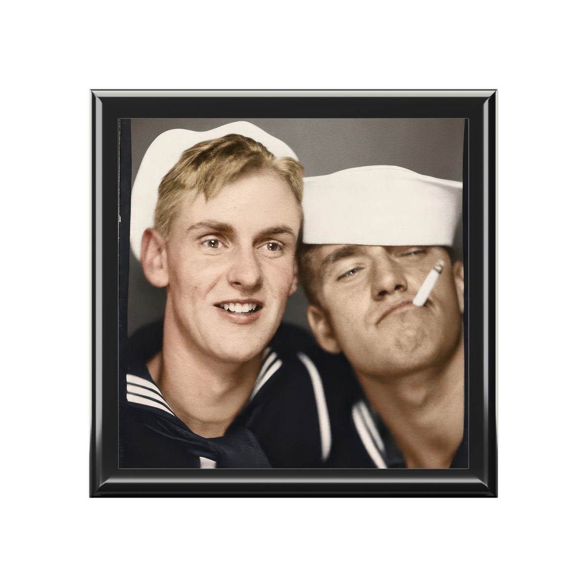 Closed wooden keepsake box with glossy ceramic tile lid featuring a colorized 1940s vintage photobooth photograph of two sailors.