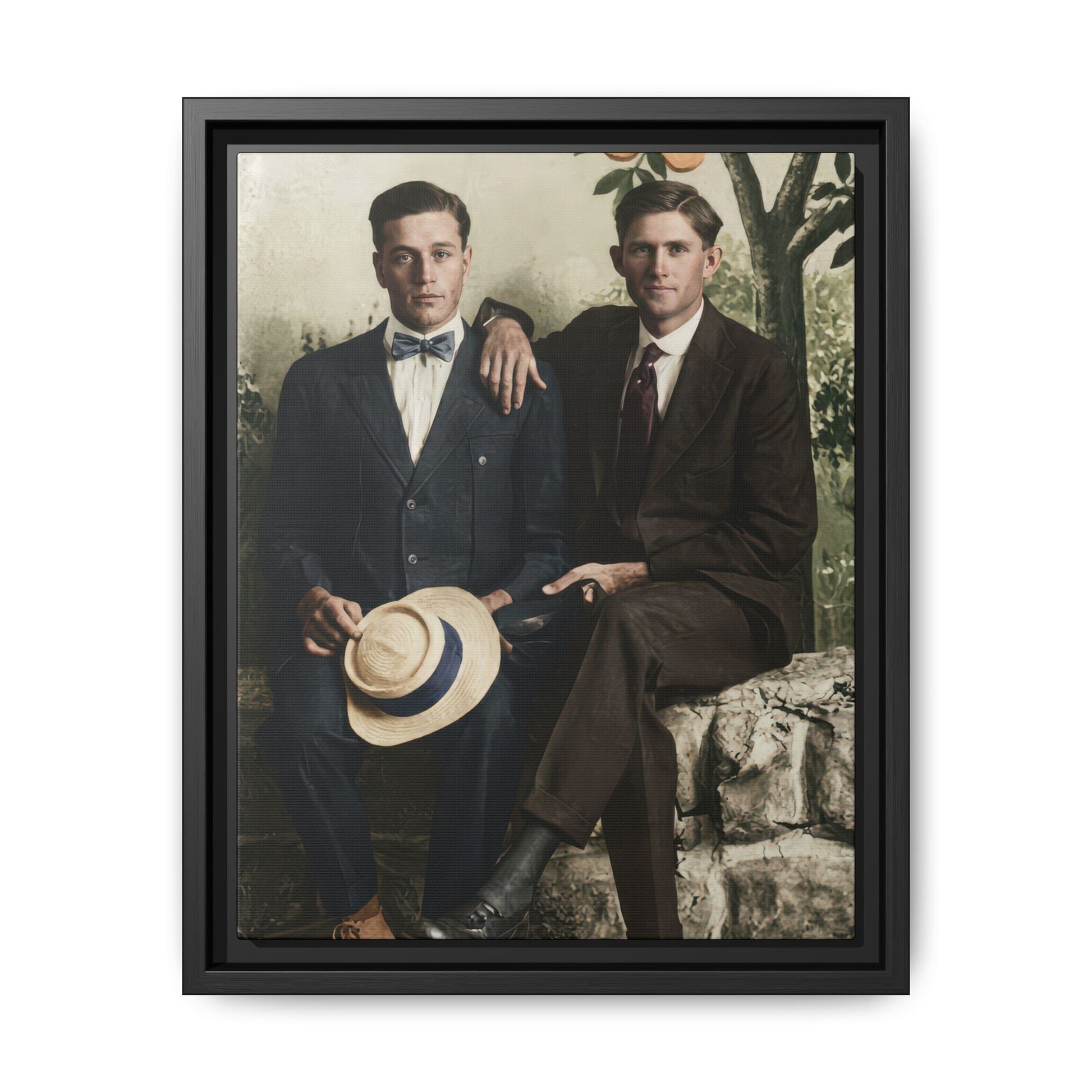 Early twentieth century studio double portrait of two men seated with painted orchard backdrop