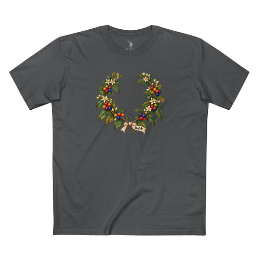 Light T-shirt featuring an Ethiopian coffee wreath with green leaves, white blossoms, Pride-colored cherries, and dark Amharic ኩራት lettering.