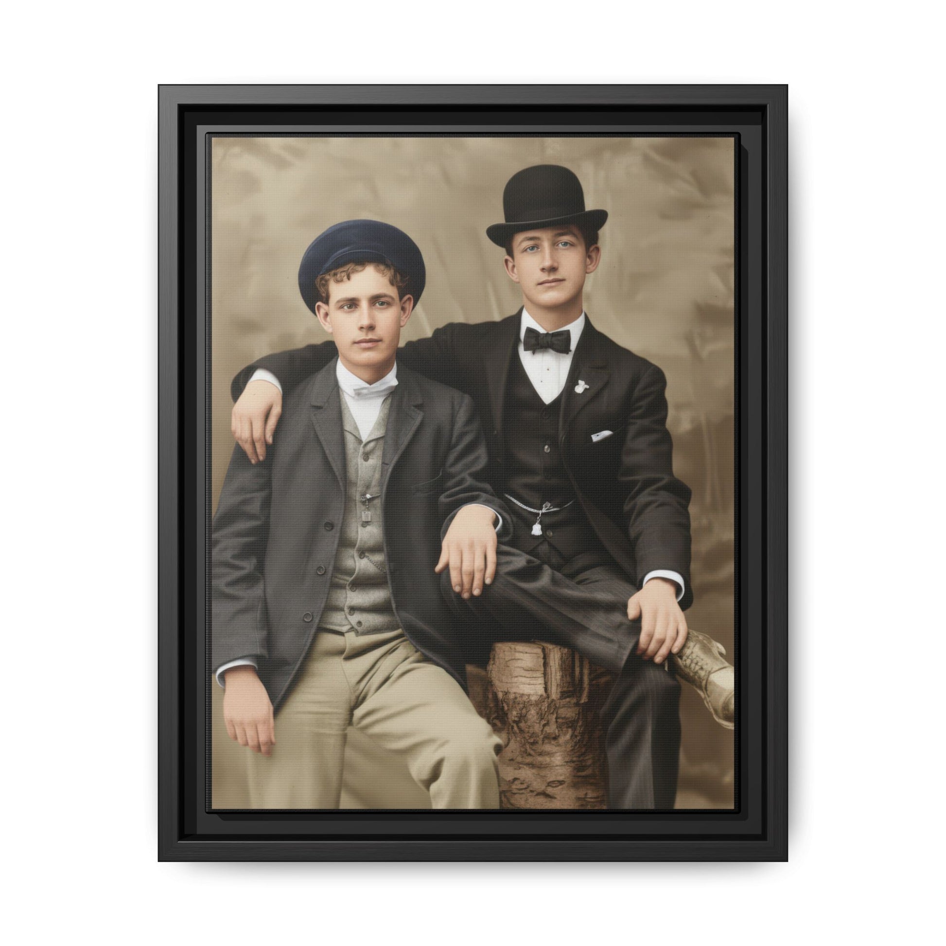 Early twentieth century studio portrait of two young men seated together wearing suits and hats