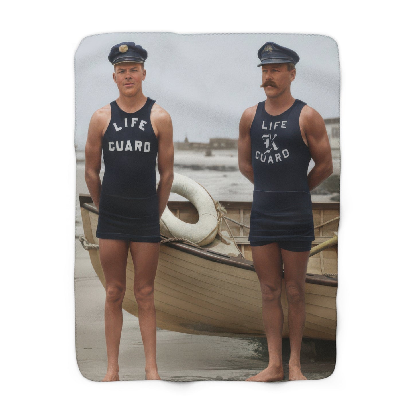 Heirloom sherpa blanket featuring two vintage lifeguards beside a rowboat on a beach 