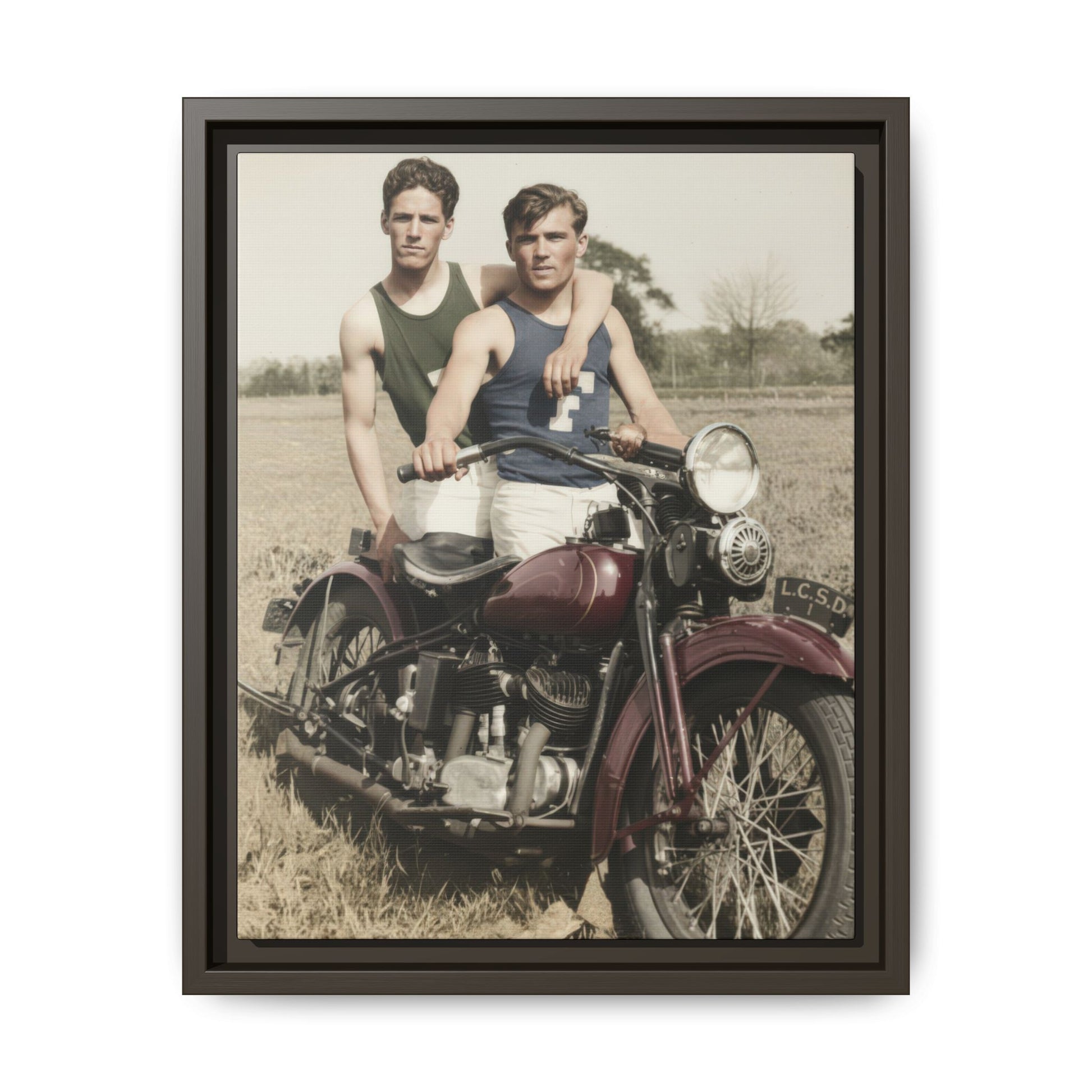 Early twentieth-century outdoor photograph of two men with motorcycle on framed canvas