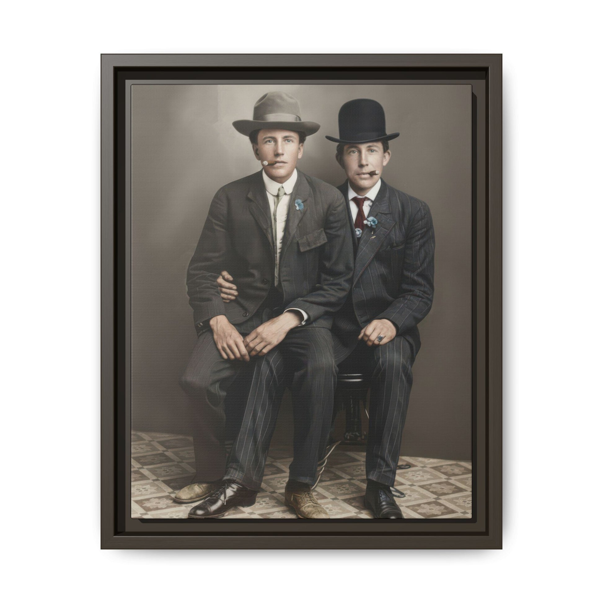 Historical studio portrait showing two seated figures in tailored striped suits and formal hats