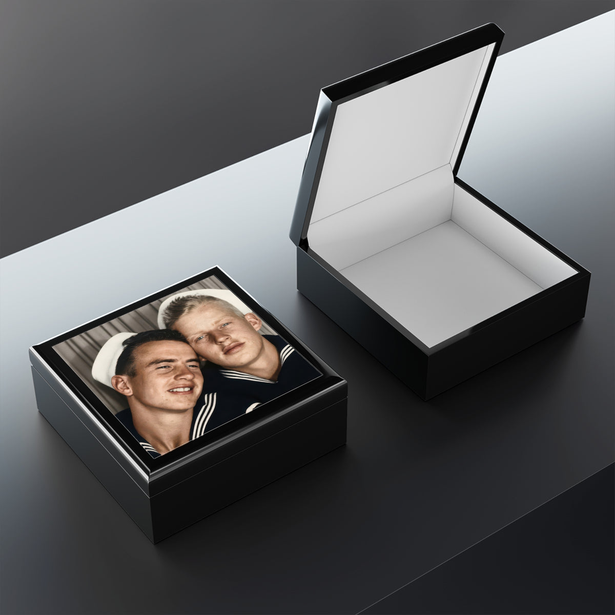 Open varnished rubberwood keepsake box with felt-lined interior and a ceramic lid featuring the vintage portrait of two sailors.