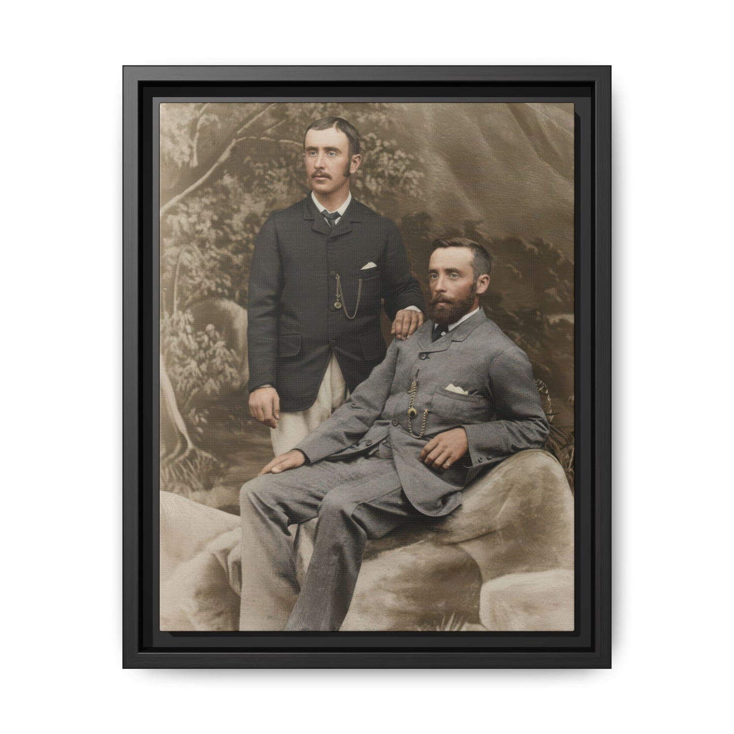 Vintage studio photograph of two suited companions with painted scenic backdrop