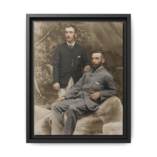 Vintage studio photograph of two suited companions with painted scenic backdrop