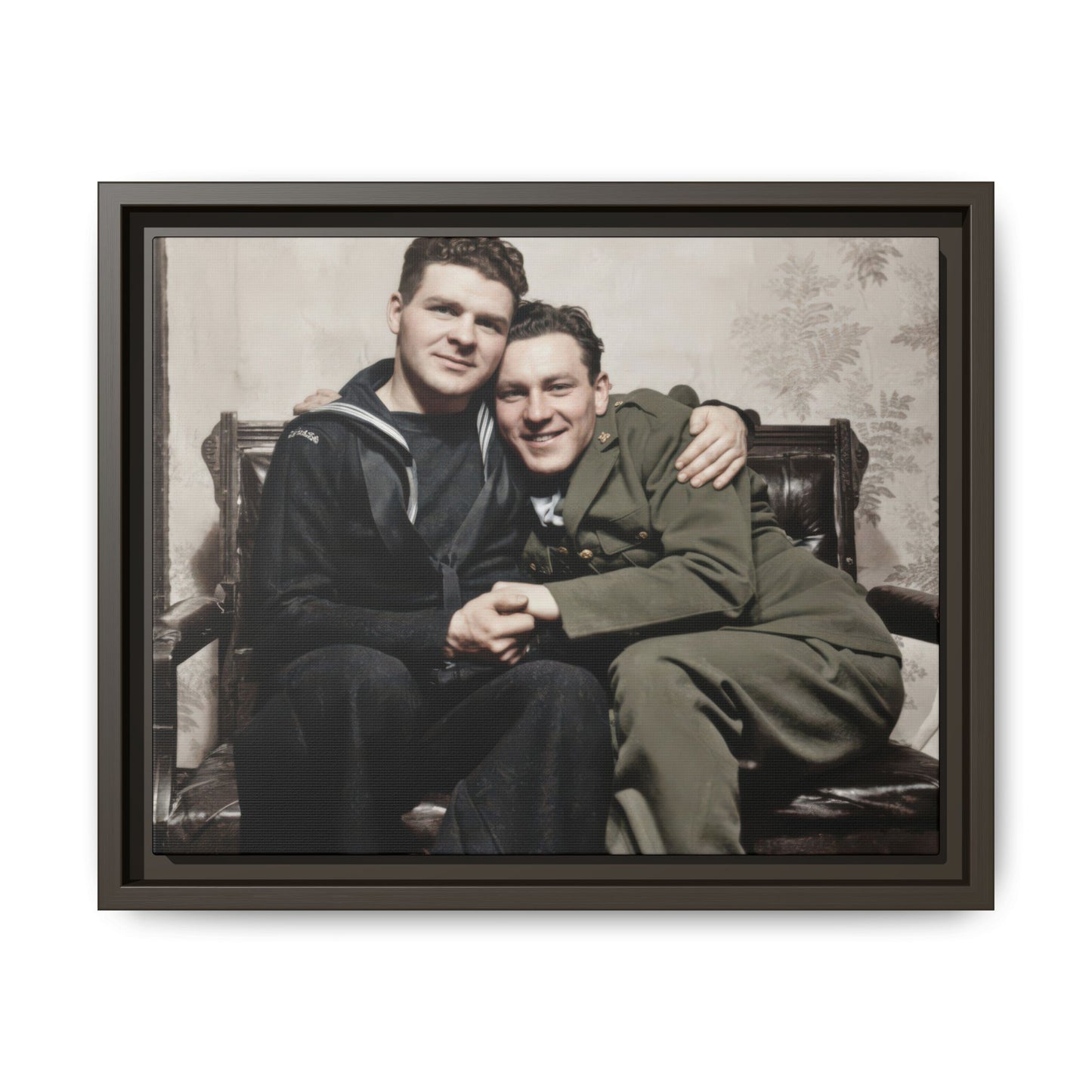 Mid-century style double portrait of two men in dark and olive uniforms seated together indoors