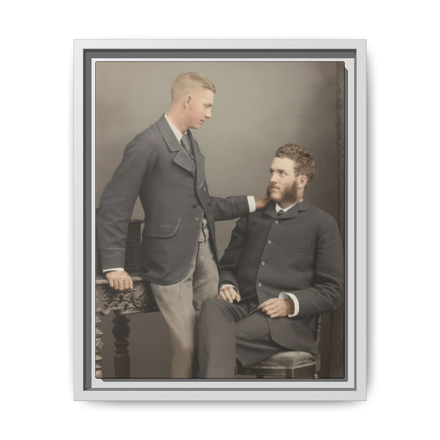 Antique two figure studio photograph with ornate table and bowler hat canvas print