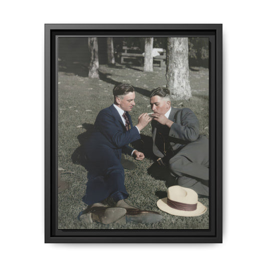 Early 20th century outdoor double portrait framed canvas wall art featuring two men seated on grass in tailored suits
