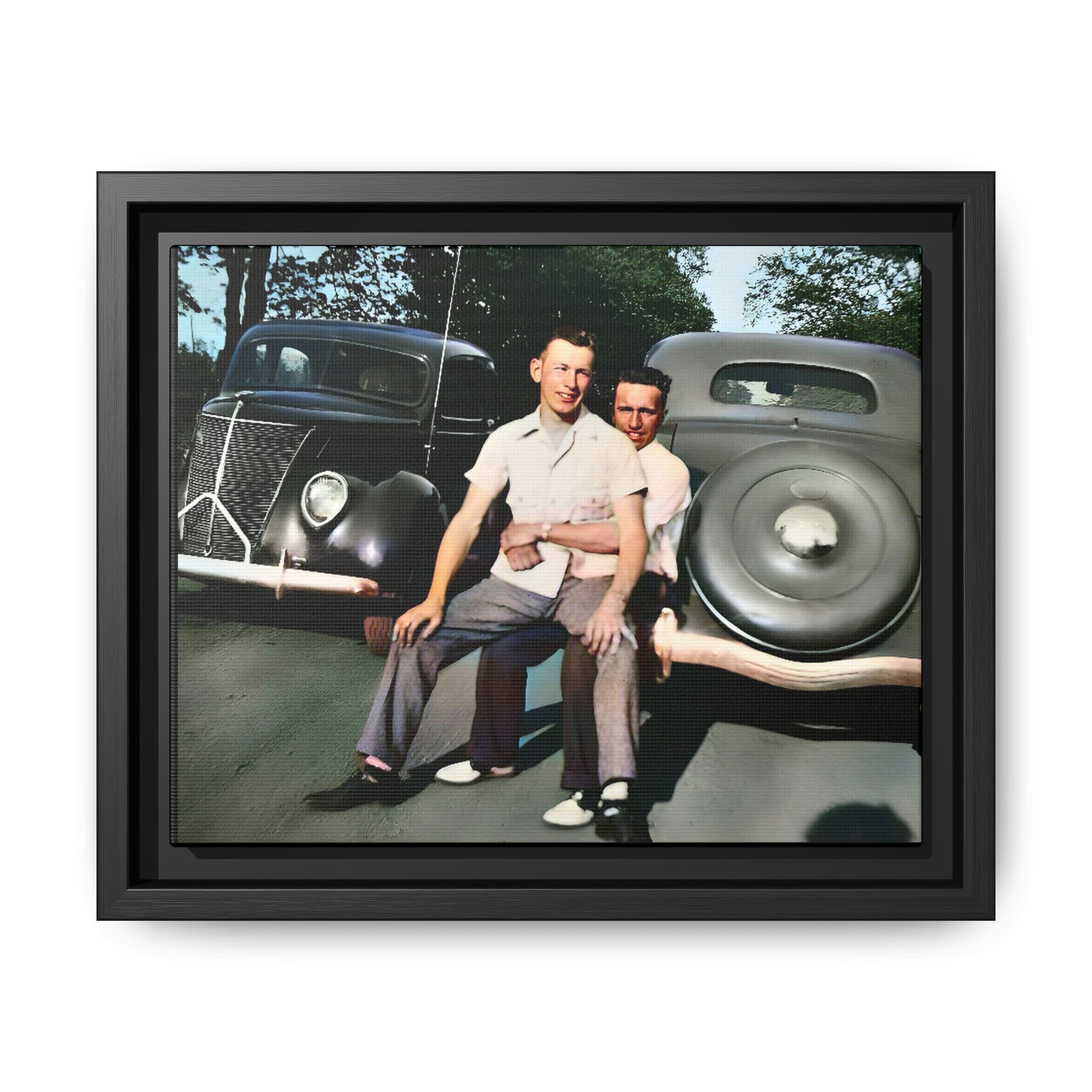 Restored 1930s vintage photo of Andrew and Eugene seated on a classic car bumper in Lincoln, Nebraska. Framed matte canvas art celebrating LGBTQ+ history, love, and timeless companionship.