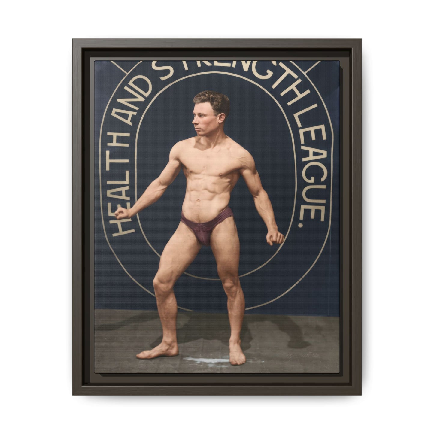 Historical fitness photography featuring muscular athlete portrait on framed canvas 