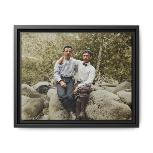 Early 20th century outdoor portrait two men seated on rock in forest setting