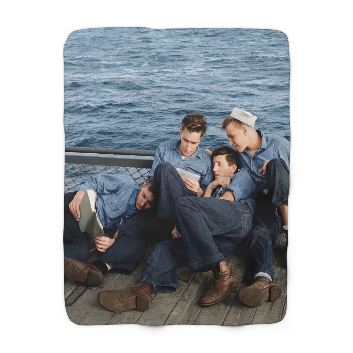 Heirloom sherpa blanket featuring four U.S. Navy sailors relaxing on a ship deck at sea 