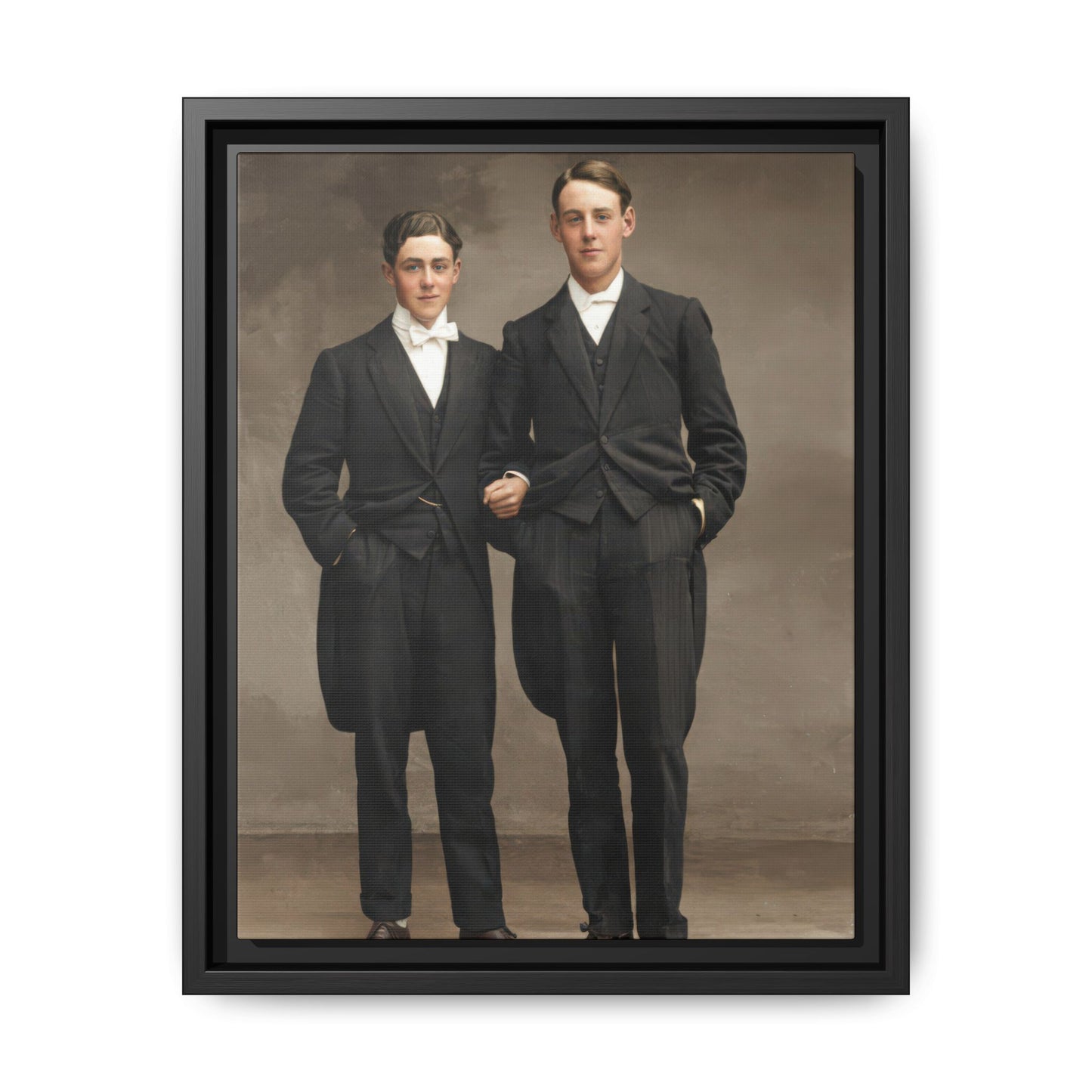 Vintage formal portrait of two standing companions in dark evening suits
